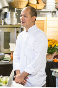 Chef at the cooking school assisting with the first class.