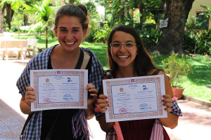 Senior Libby Dowley receives a certificate for being a teacher intern in Cambodia over the summer.