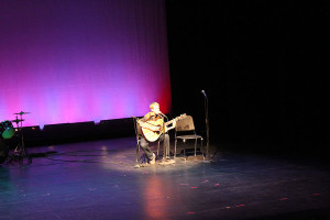 Damien Beecroft plays guitar and sings at the ASD Talent Show. 