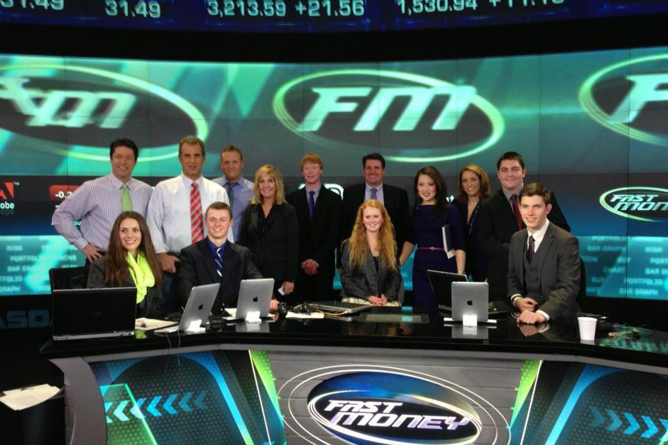 The students and Bonadies smile while on the set of CNBCs Fast Money, a television show that documents and analyzes stocks.