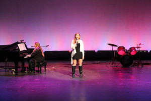Sage Lucero accompanied by Sue Wasienko on the piano preformed “A Thousand Miles”.