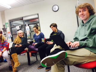 Gabe Hjorth, Drew Altman, and Brooke Pisani on their phones and computers during no technology day.  
