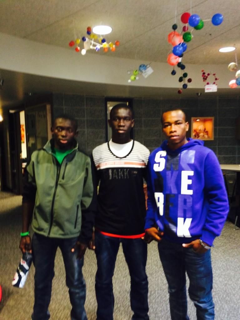 Students+from+Gambia+pose+in+the+hallways+of+AHS.