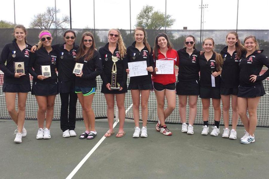 The AHS girl’s tennis team shows of their medals on the tennis court after winning the Delta Invitational Tennis Tournament. 