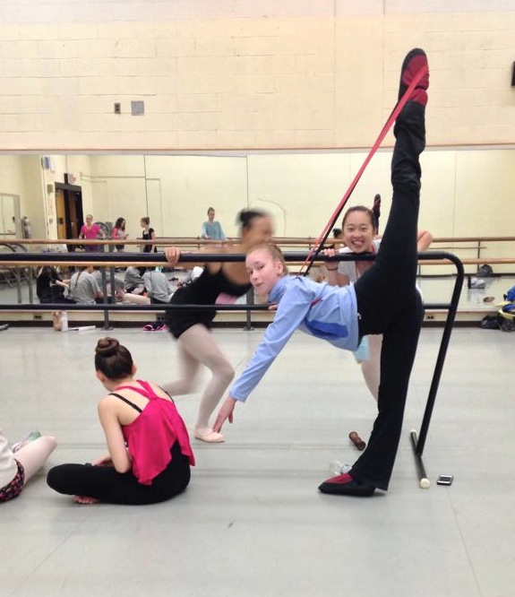 Emily Ridings stretches and warms up before a morning class at the Bolshoi Summer program in New York.