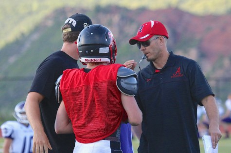 From Left: Coach Alex Wood,Evan Scott Morris and Head Coach Ryan Treice  discuss strategies during practice.