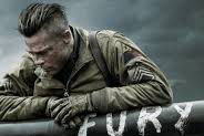 Brad Pitt poses by the Sherman tank Fury, which the movie is logically centered around.