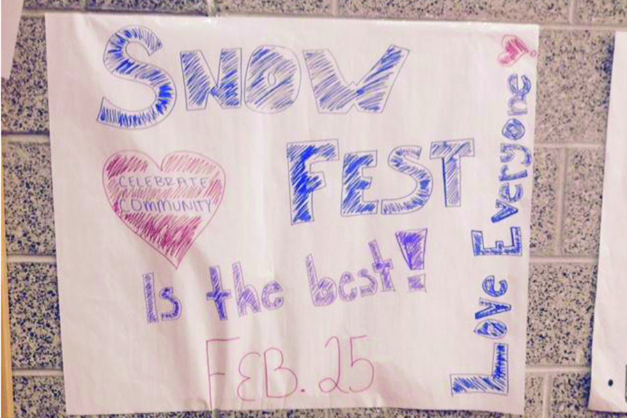 A poster highlighting Snow Fest community values is hung at the bottom of the red staircase.