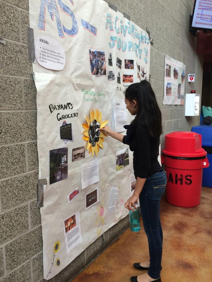 Sophomore Nakiri Gallagher-Cave adds the finishing touches to her Ex Ed poster.