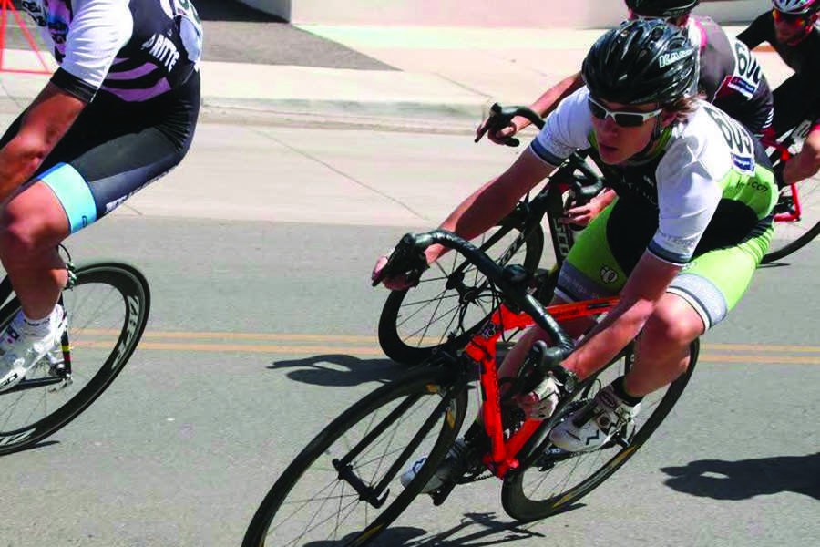 Kevin Callahan, in green, speeds through a corner during a New Mexico road race.