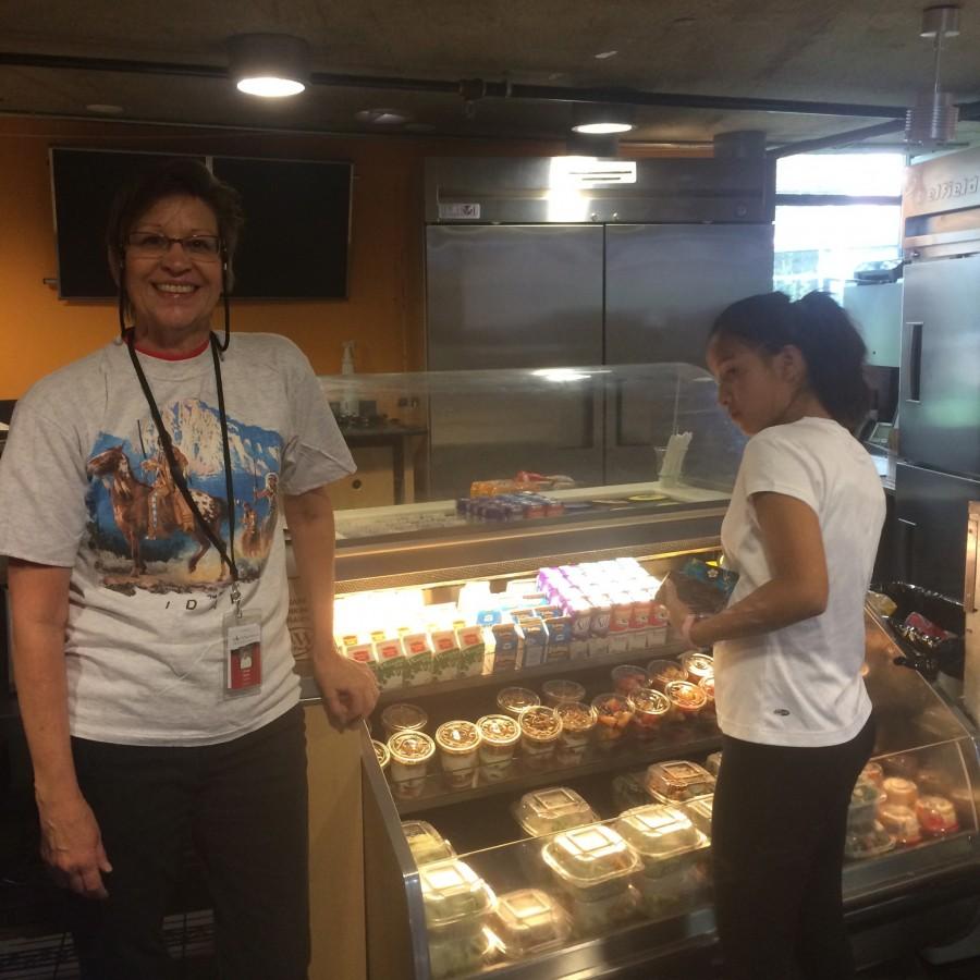 Photo courtesy of Carson Friedland
AHS junior, Pema Sarick, looks at the new food in the cafeteria.