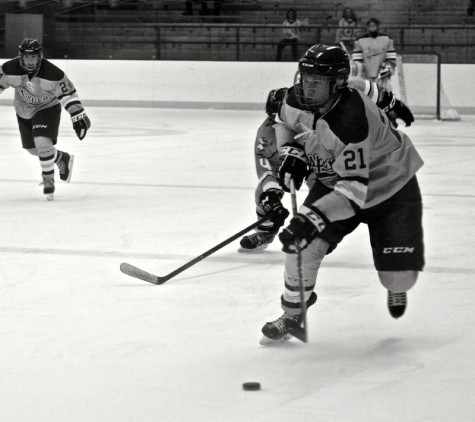 Van Allen skates through defenders at the Aspen Ice Garden.