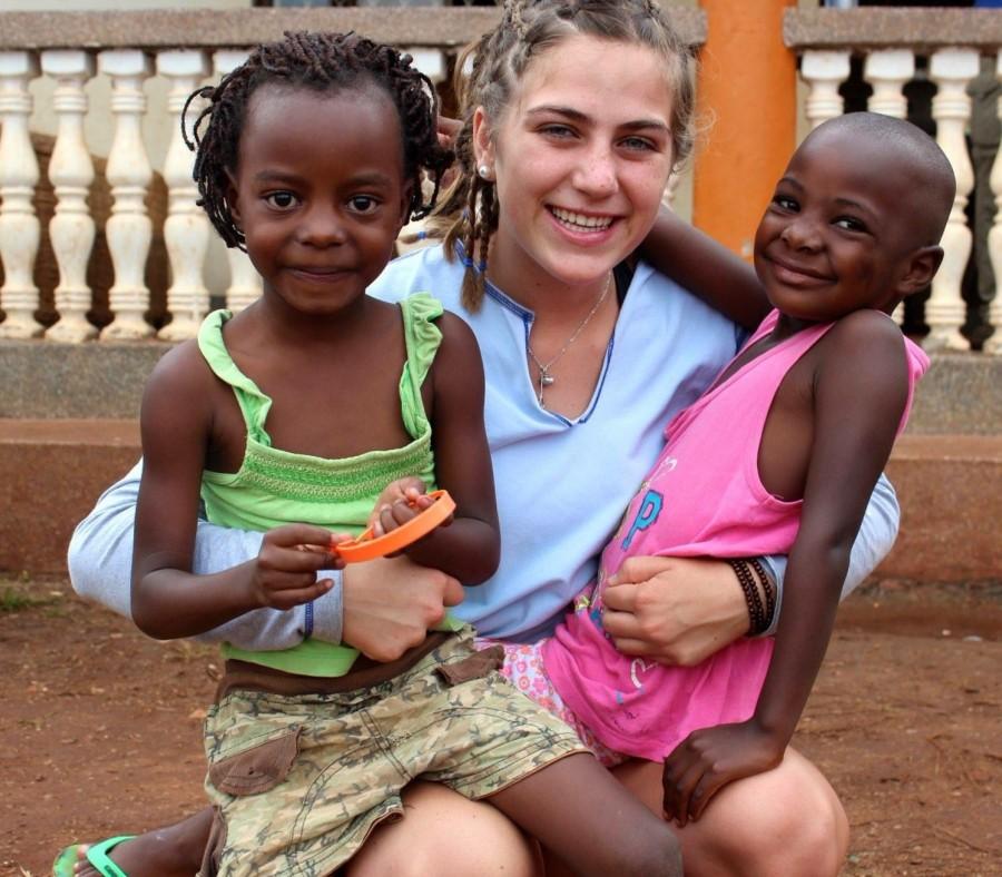 Caroline Moriarty with 2 students, Carol and Joan, right outside of the Center in Uganda, earlier this year.