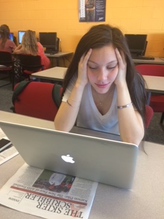 Junior Jordana Rothberg takes a deep breath as she looks at her homework for the week.