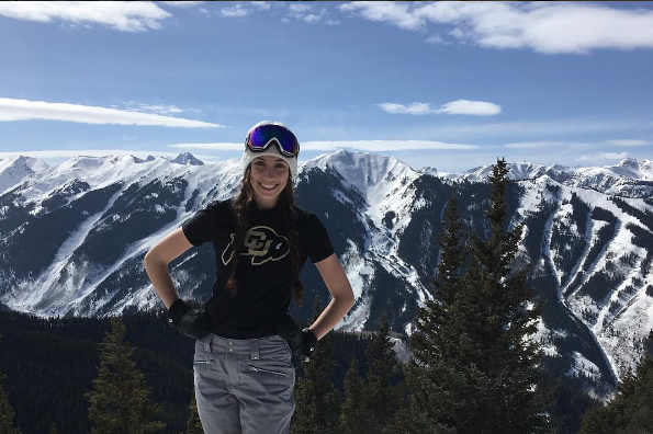 Nikki on the top os Aspen Mountain showing her Buff pride. 