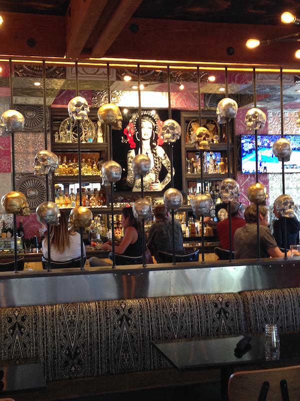 The Day of the Dead theme is portrayed at the bar with its lining of skulls.
