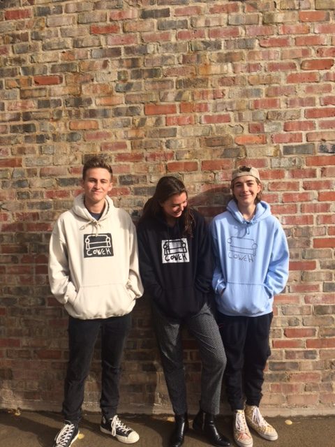 Senior Jeremy Davis (far right), and juniors Jordan Fox and Dylan DeGraff repping “COWCH” sweatshirts. 