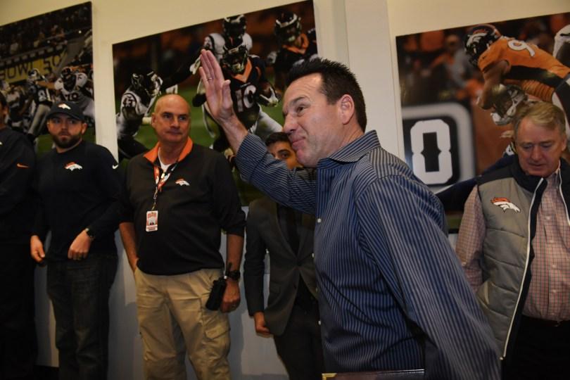 Denver Broncos head coach, Gary Kubiak, waves his goodbye to the team and staff after his announcement of his retirement.