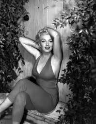 Marilyn Monroe showing off her curves.
