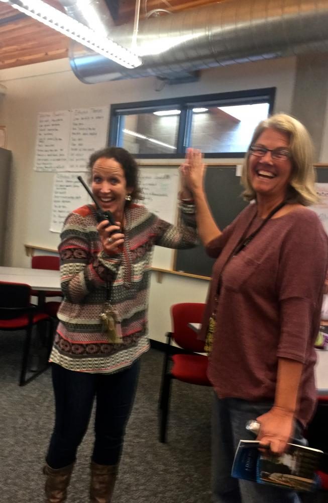 Left: Assistant Principal Sarah Strassburger says hello to co-worker, IB English teacher Cerena Thomsen. 

