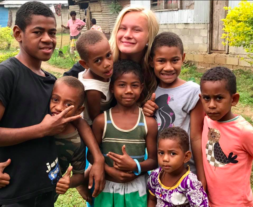 AHS sophomore Olivia Zwieg with children of The Fiji Islands.