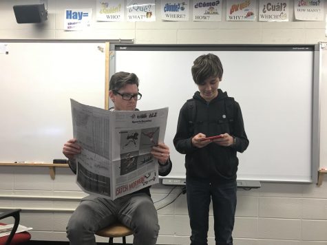 Joey Dziedzic and Gavin Heil both catching up on the news. 