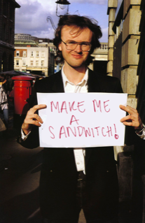 Richard Daeh carries a poorly decorated and misspelled homemade sign at the first annual Men’s March.