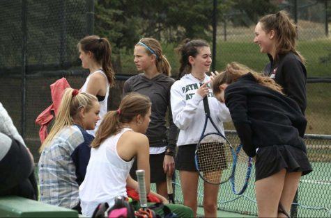 Members of the AHS Girls Tennis Team preparing for the upcoming regional tournament.