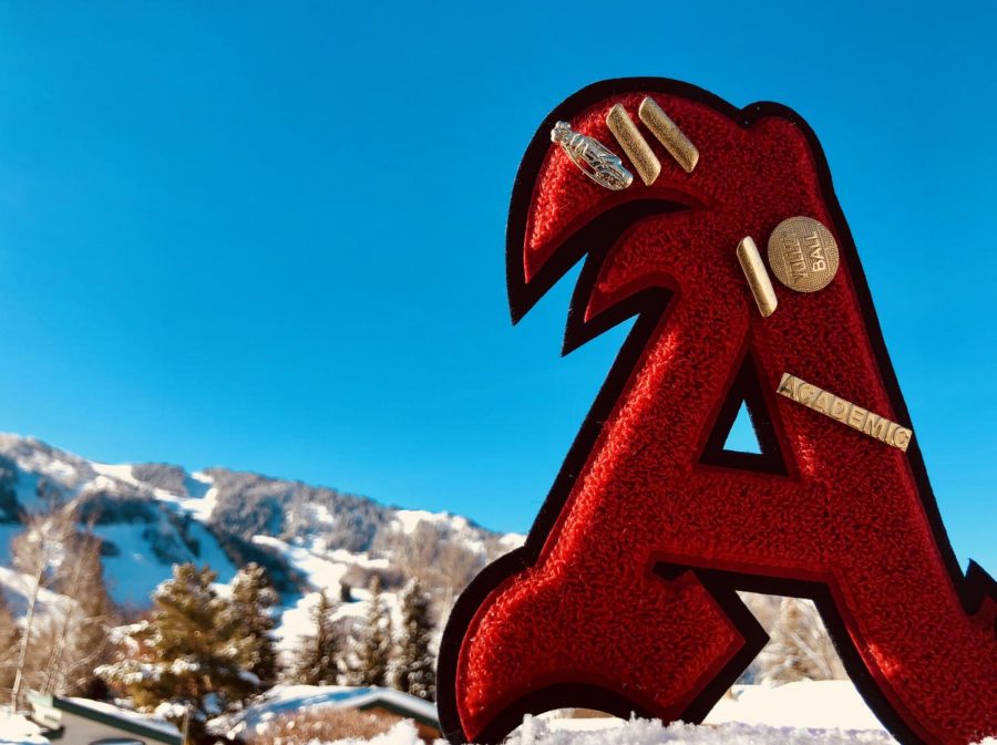Zoe Guthries varsity letter from AHS with Aspen mountain in the background. 