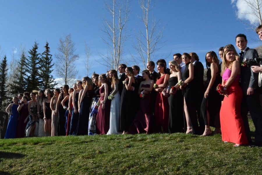 AHS students pose for prom pictures during the golden hour.