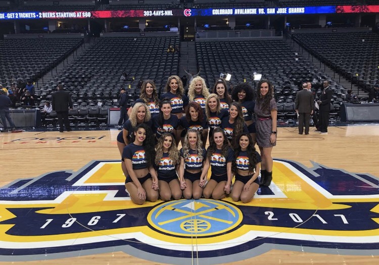  New head coach, Maddy Miller, posing for a picture with the Denver Nuggets. (Pictured center, 3rd row)