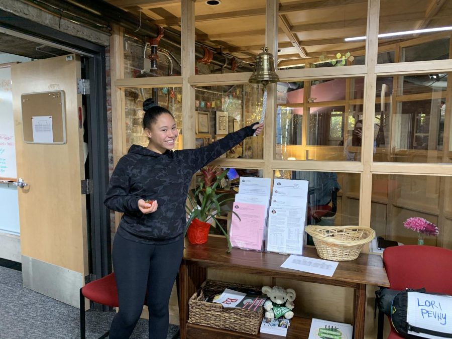 Bella Williams ringing the bell after sending in her college application.