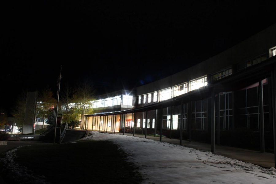 Lights shine through the windows of the school, despite being vacant each night.