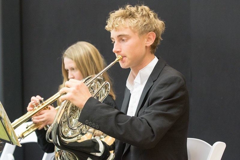 Daniel Jansen, a junior at AHS, plays the French Horn in concert