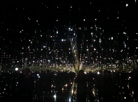 A view of “Where the Lights in My Heart Go” inside the Aspen Art Museum. Yayoi Kusamas exhibition features mirrors surrounding the room.