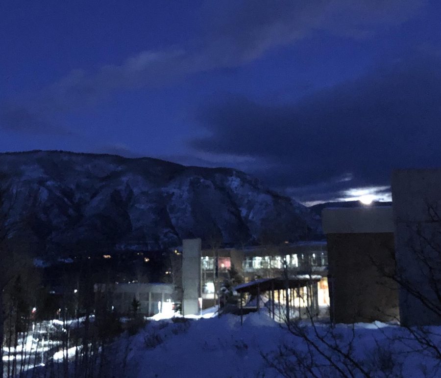 The moon rises behind Aspen High School at the early time of 5:30 pm on a recent night. For some people, the decreased amount of daylight can lead to Seasonal Affective Disorder.
