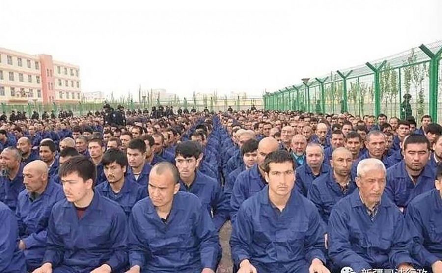 An+undated+file+photo+of+Uighurs+being+held+at+a+detention+center+in+Xinjiang%2C+China.