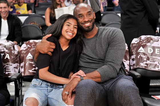 Kobe Bryant hugs his daughter Gianna during a Los Angeles Lakers game on Nov. 17, 2019.