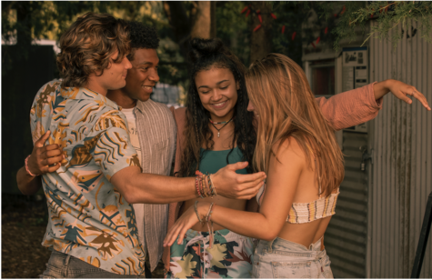John B., Pope, Kiara, and Sarah hugging on. the set of Outer Banks.