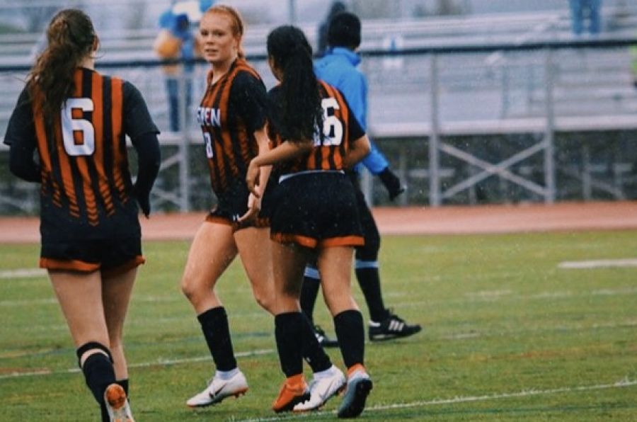 AHS 2020 Womens Soccer Seniors, Karen Galvan-Sanchez, Payton Curley, and Maeve McGuire playing in a home game last Spring. 
