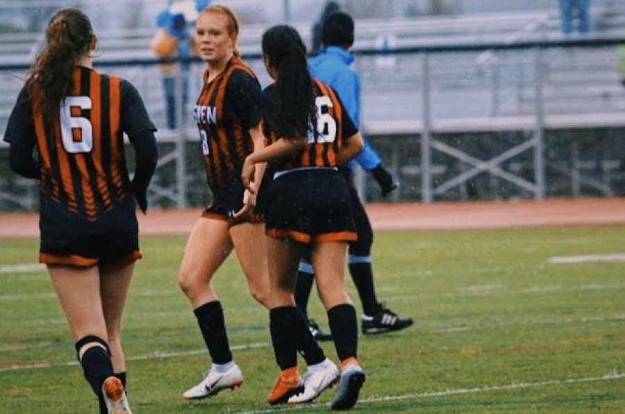 AHS 2020 Women's Soccer Seniors, Karen Galvan-Sanchez, Payton Curley, and Maeve McGuire playing in a home game last Spring. 