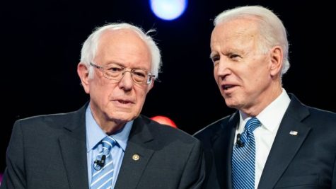 Bernie Sanders and Joe Biden having a conversation.