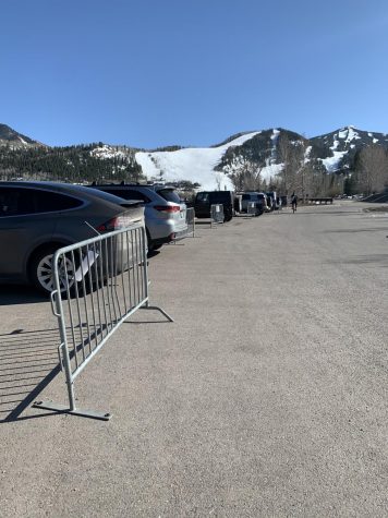 Many cars sit in the Tiehack parking lot.