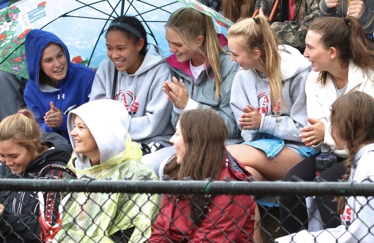 Seniors, Charlotte Howie, Bella Williams, Hayley Heinecken, Lauren Fox, Kat Goralka (from left to right) and Sammi Jaworski (bottom row), watch an AHS Mens Lacrosse game last Spring. 