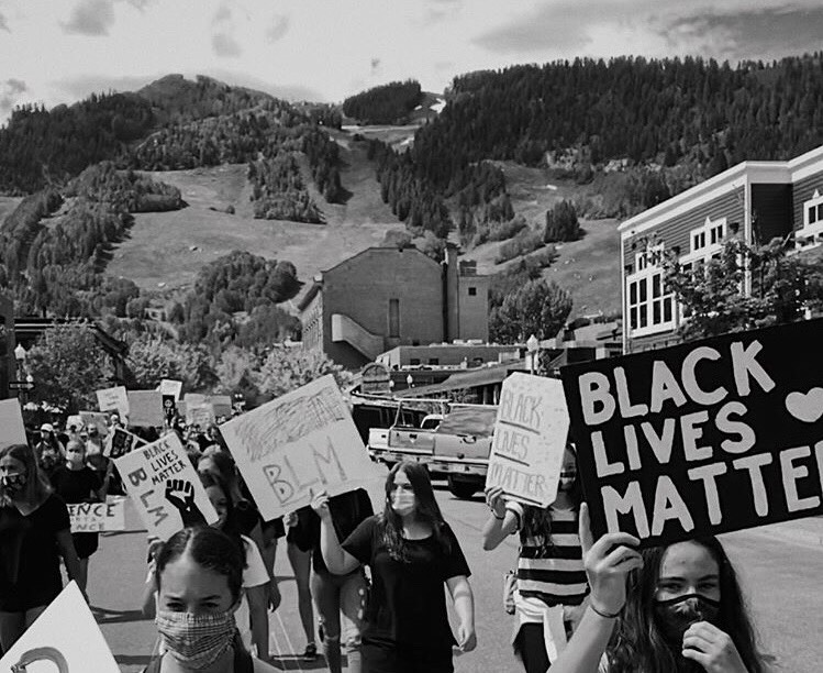 Local protestors marching in the streets to support Black Lives Matter.