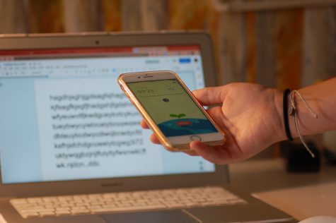 Student using Flora, a app where users can grow a virtual garden, to prevent distractions on their phone during online learning.