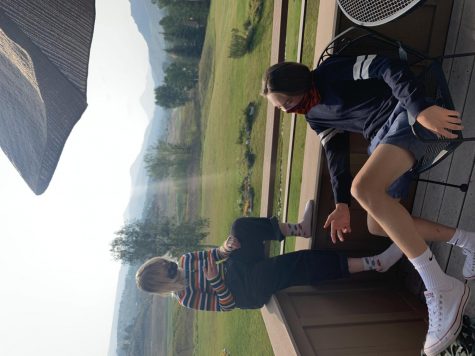 Alice Collins (left) and Bo Melton relax on a deck during the two hour lunch period.