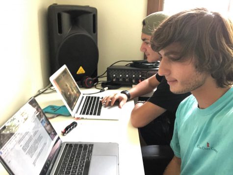 Elijah Goldman (front) and Lian Lilah sit together while doing online school.