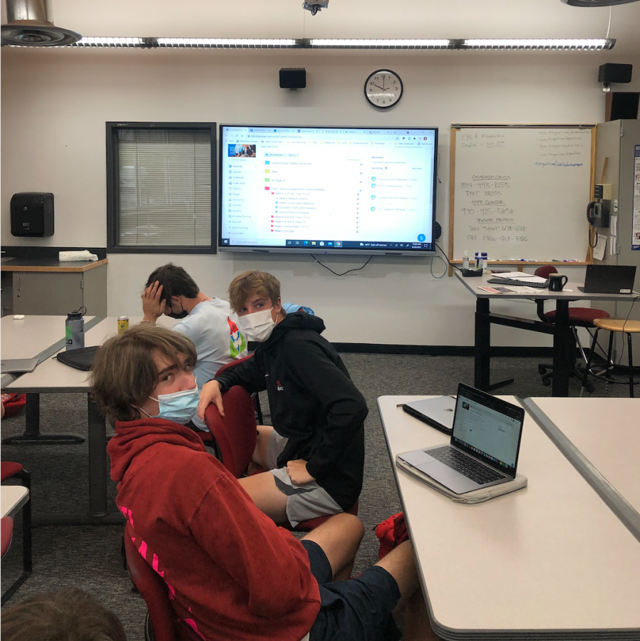 Students from Sheri Smiths class, front to back, Hudson Nunes, Simon holloway, Martin Scanlan, get taught using Schoology in room 1239 in AHS on Wednesday, Sept. 29, 2021.