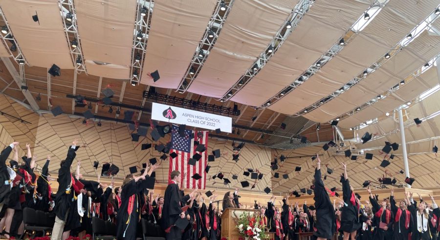 AHS graduates throw their caps in celebration. 
